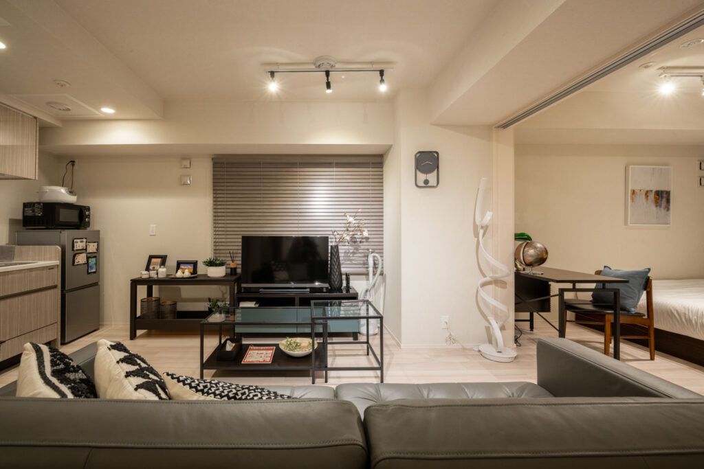 Interior living room and bedroom of a used apartment for sale in Sapporo, perfect for a vacation condo.