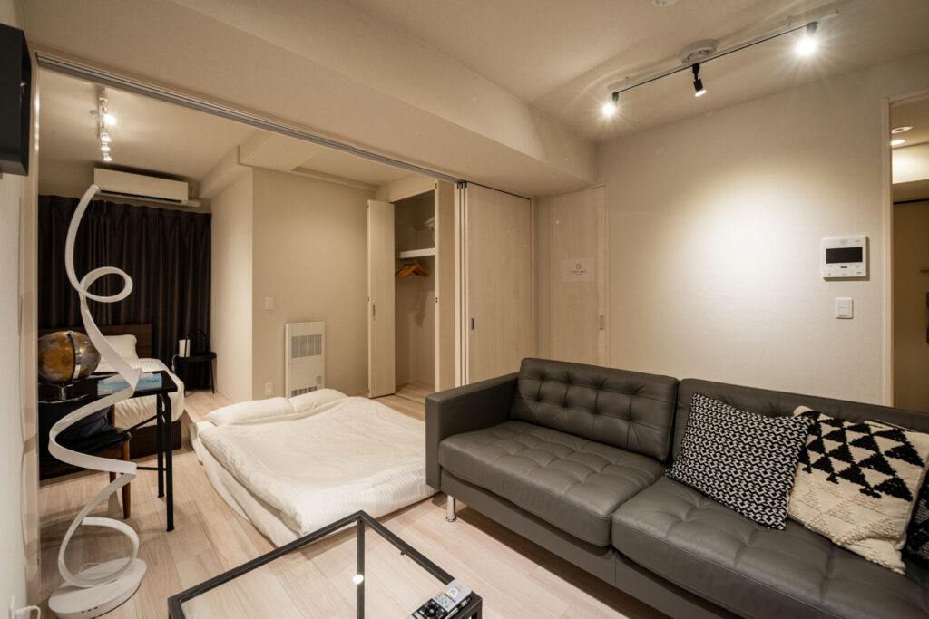 Clean and modern kitchen and bathroom facilities in a Sapporo second-hand condominium available for sale.